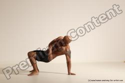 Underwear Gymnastic poses Man Black Muscular Bald Dancing Dynamic poses Academic